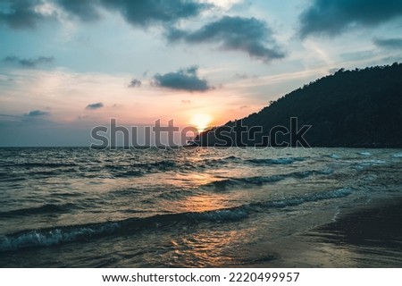 Beautiful scenic landscape with dramatic cloudy sky at sunset and a sun glade on a ripple sea water in Sihanouk ville, Gulf of Thailand, Pacific Ocean, Cambodia, South East Asia. sunset, sundown, dusk Royalty-Free Stock Photo #2220499957