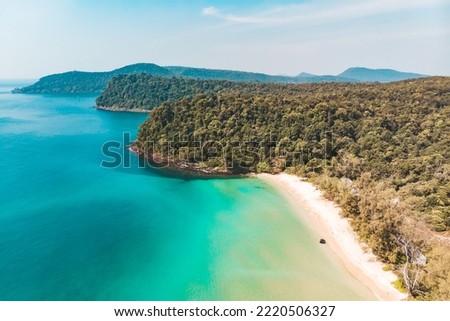 Coast of island Koh Rong Samloem, Cambodia. Long deserted beach with white sand and clear water. Aerial top view. Royalty-Free Stock Photo #2220506327