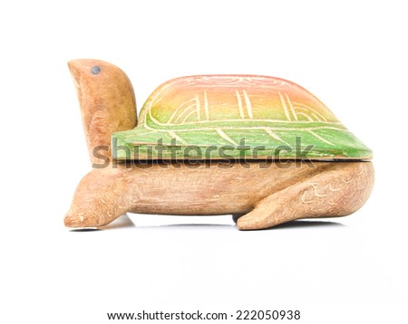 Colorful wooden turtle isolated on white background. souvenir handmade from the North of Thailand