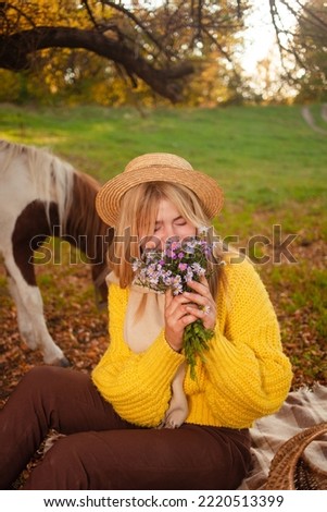Beautiful screensaver, background, autumn forest, woman and pony in nature, concept of love, peace and goodness. posy