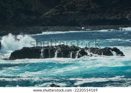The waves break on the volcanic cliffs of La Fajana on the island of La Palma. Canary Islands. Spain