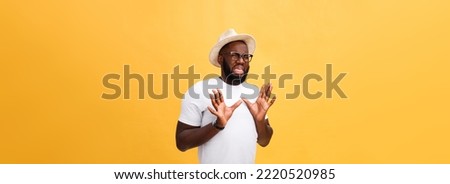 Closeup portrait of shocked mad young man raising hand up to say no stop right there, isolated on yellow background. Negative emotion facial expression feelings, signs symbols, body language Royalty-Free Stock Photo #2220520985