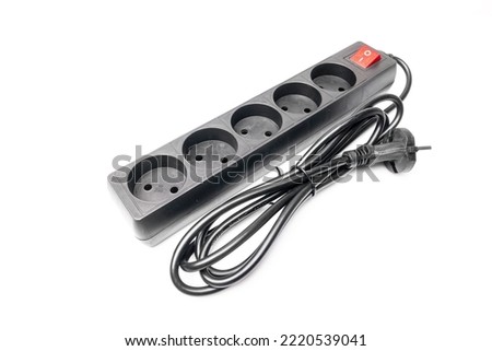 Extension cord for electricity with a cable and a switch on a white background Royalty-Free Stock Photo #2220539041