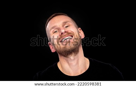 A man with an evil smile on a dark background.A man with an evil smile on a dark background. Royalty-Free Stock Photo #2220598381