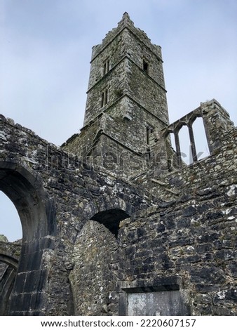 The tower of Kilconnell Abbey, a ruined medieval Franciscan friary in Kilconnell, Galway county, Connacht, Ireland Royalty-Free Stock Photo #2220607157