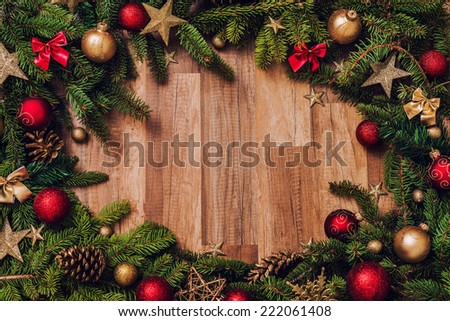 Christmas tree with baubles on wood texture.
