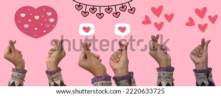Heart in Hands Symbol, Love and Heart Sign Symbol on a Green Screen Background Represent a Korean Heart Sign Symbol. Korean Hand Love Sign Royalty-Free Stock Photo #2220633725