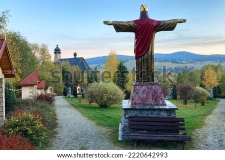 Symbolic Golgotha mountain in Tylicz town, Malopolska Voivodeships of Poland. Church of the Holy. Ap. Peter and Paul in Tylich town, Lesser Poland region Royalty-Free Stock Photo #2220642993