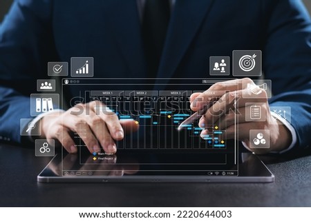 Businessman at the executive level analyzes the work strategy of the organization. Measure success with KPI, improve performance. Investigate and correct deficiencies, measure results concretely. Royalty-Free Stock Photo #2220644003