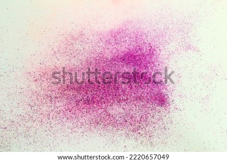 Colorful rainbow diwali holi festival rangoli purple color powder isolated on white background,selective focus
