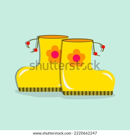 Illusttration, children’s yellow boots a flower on a blue background.