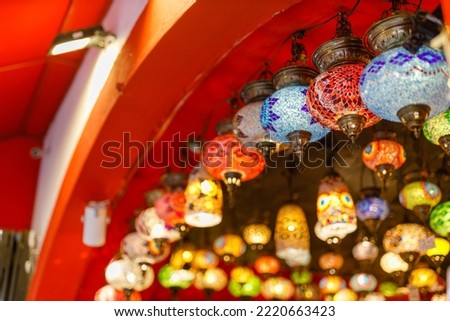 Mosaic colorful glass decorations lamps. Travel tourism concept photo. Colorful turkish lamts hanging on the roof indoor view.