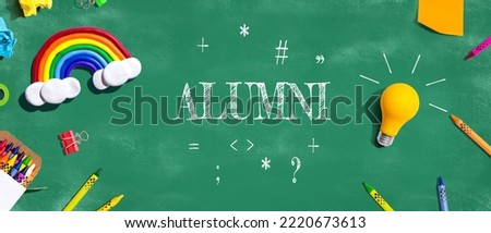 Alumni theme with school supplies overhead view - flat lay Royalty-Free Stock Photo #2220673613