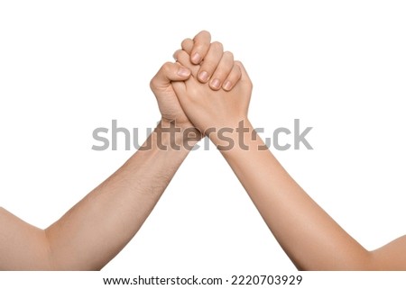 Man and woman in arm wrestlin. Friends greeting each other. Concept of standoff, support, friendship, business, community, strained relations.