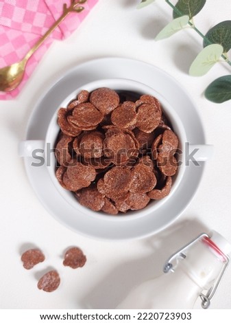 Choco cereal in ceramic bowl. Isolated background in white. Bright mood photography. Minimalist concept.