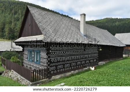 Village with old wooden houses in Slovakia village Cicmany, with traditional painted  white linear symbols. Čičmany, Zilina region, Slovakia. Slovak UNESCO heritage.