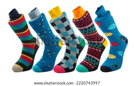 Colorful socks on a white background. Cotton or wool socks. Textures and patterns are trendy socks.
