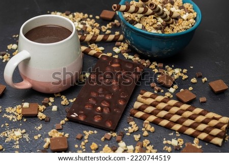 Chocolate granola cereals with chocolate milk and waffle rolls