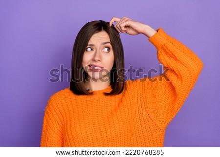 Photo of minded pretty girl look interested empty space finger scratch head isolated on violet color background