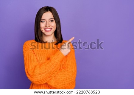 Photo of cheerful pretty person indicate finger empty space novelty isolated on violet color background