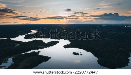 Amazon rainforest rivers with reflection and sunset light