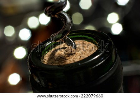 Close Up Of Uncorking A Bottle Of Wine With Blur Background Bokeh On Silvester At Night Royalty-Free Stock Photo #222079660