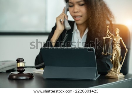 Lawyers having through online Concepts  of Legal services at the law office.