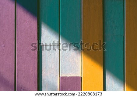 Multicolor effective wood wall texture. Wooden planks in multi-pastel colours with vintage style for background and texture. Beautiful wooden striped background painted with pastel paint., Wood planks