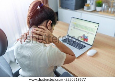Woman having Neck and Shoulder pain during work long time on workplace. due to fibromyalgia, rheumatism, Scapular pain, office syndrome and ergonomic concept Royalty-Free Stock Photo #2220819577