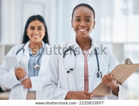 Healthcare, women and doctors with patient chart on clipboard in hospital or clinic. Happy black woman doctor, medical partnership and insurance documents, diversity and leadership in health care. Royalty-Free Stock Photo #2220833897