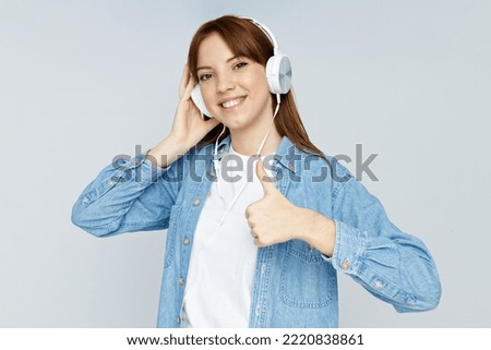 Concept of people, girl with headphones on light background