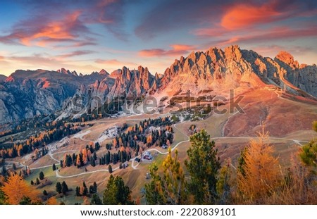 Gorgeous morning view of Gardena Pass. Spectacular auatumn sunset in Dolomite Alps. Magnificent outdoor scene of Italy, Europe. Traveling concept background.