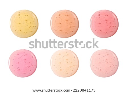 Gel colorful set. Gloss face make-up samples palette. Set of colorful transparent cosmetic liquid lipgloss in different colour smudge smear strokes. Make up smears isolated on a white background Royalty-Free Stock Photo #2220841173