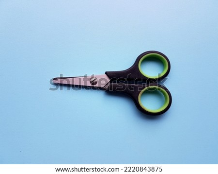 Scissors on a blue background.
