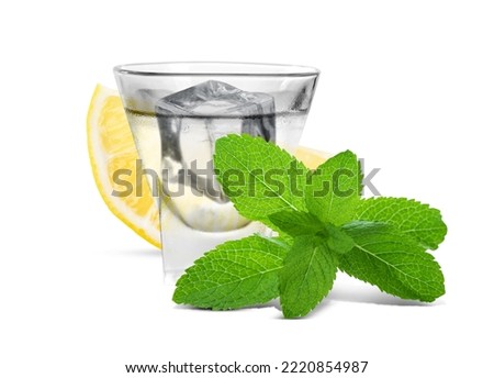 Shot of vodka with ice, lemon and mint on white background
