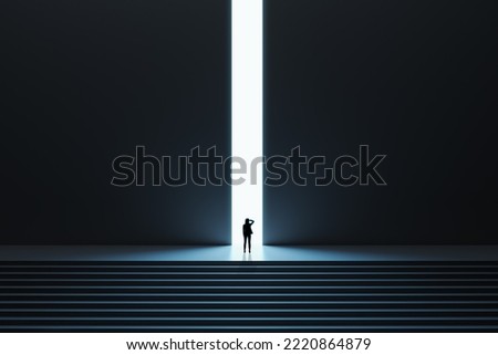 Business success and opportunity concept with pensive woman in front of bright light hole in the middle of wall in a dark huge dark hall with stairs Royalty-Free Stock Photo #2220864879