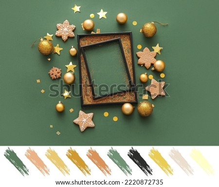 Composition with empty frame, Christmas decorations and cookies on green background. Different color patterns