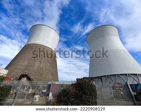Massive chimneys at Slough trading estate - industrial area Royalty-Free Stock Photo #2220908129