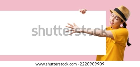 Web banner of digital advertising. A young Caucasian pretty woman wearing straw hat holds a big billboard with mock up and reaches hand. Copy space. The concept of online shopping