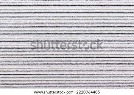 Black and white striped carpet viewed from above