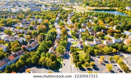 Aerial view of upscale residential area, gated community street real estate with single family homes. Autumn sunny day. Royalty-Free Stock Photo #2220967315