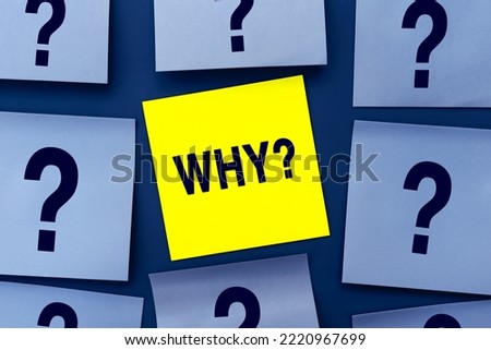 The Word Why message on card for presentation, business. Yellow sticker among blue note papers. Business concept. Home Office Royalty-Free Stock Photo #2220967699