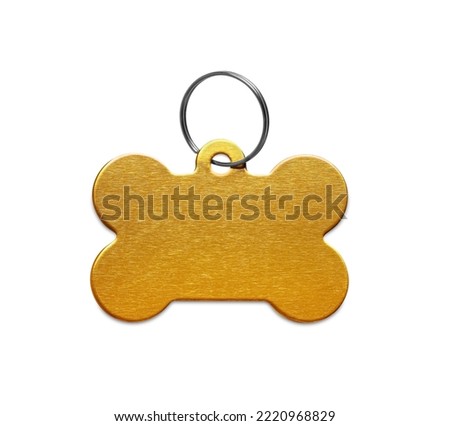 Golden metal bone shaped dog tag with ring isolated on white