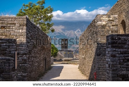 Clock Tower in Gjirokaster Citadel surrounded by ancient ruins, attraction in Albania, Europe. High quality photo