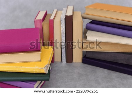 Stack of book on gray background