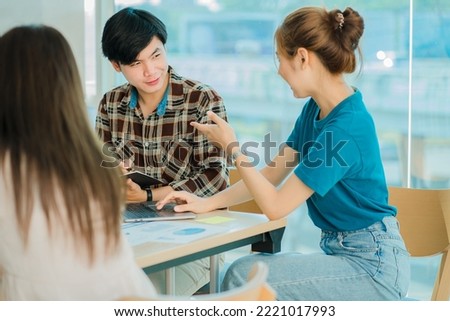 
Young happy Asian businessman working together to start a business in creative team brainstorming meeting Successful business partner team work concept
