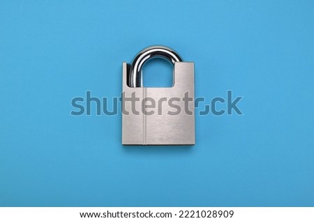 Chrome padlock on a blue background.