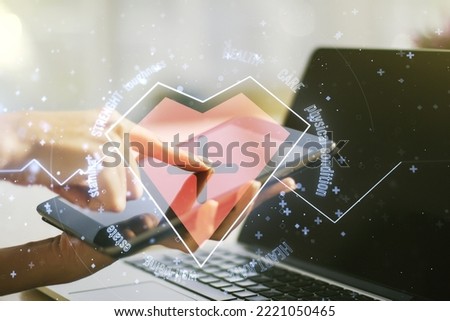 Double exposure of creative abstract heart rate hologram and finger clicks on a digital tablet on background. Healthcare technolody concept