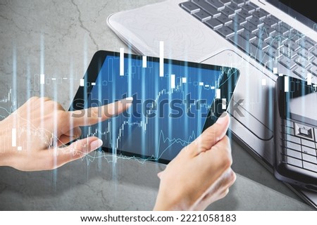 Hands holds digital tablet with a blank screen