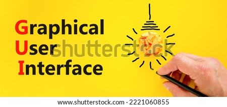 GUI graphical user interface symbol. Concept words GUI graphical user interface on a beautiful yellow background. Light bulb. Business and GUI graphical user interface concept. Copy space.